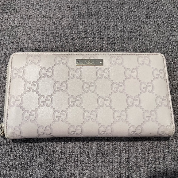 Gucci Handbags - Authentic Gucci Guccissima Ivory Leather long zip around wallet